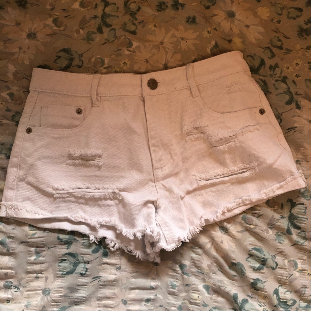 White ripped jean shorts